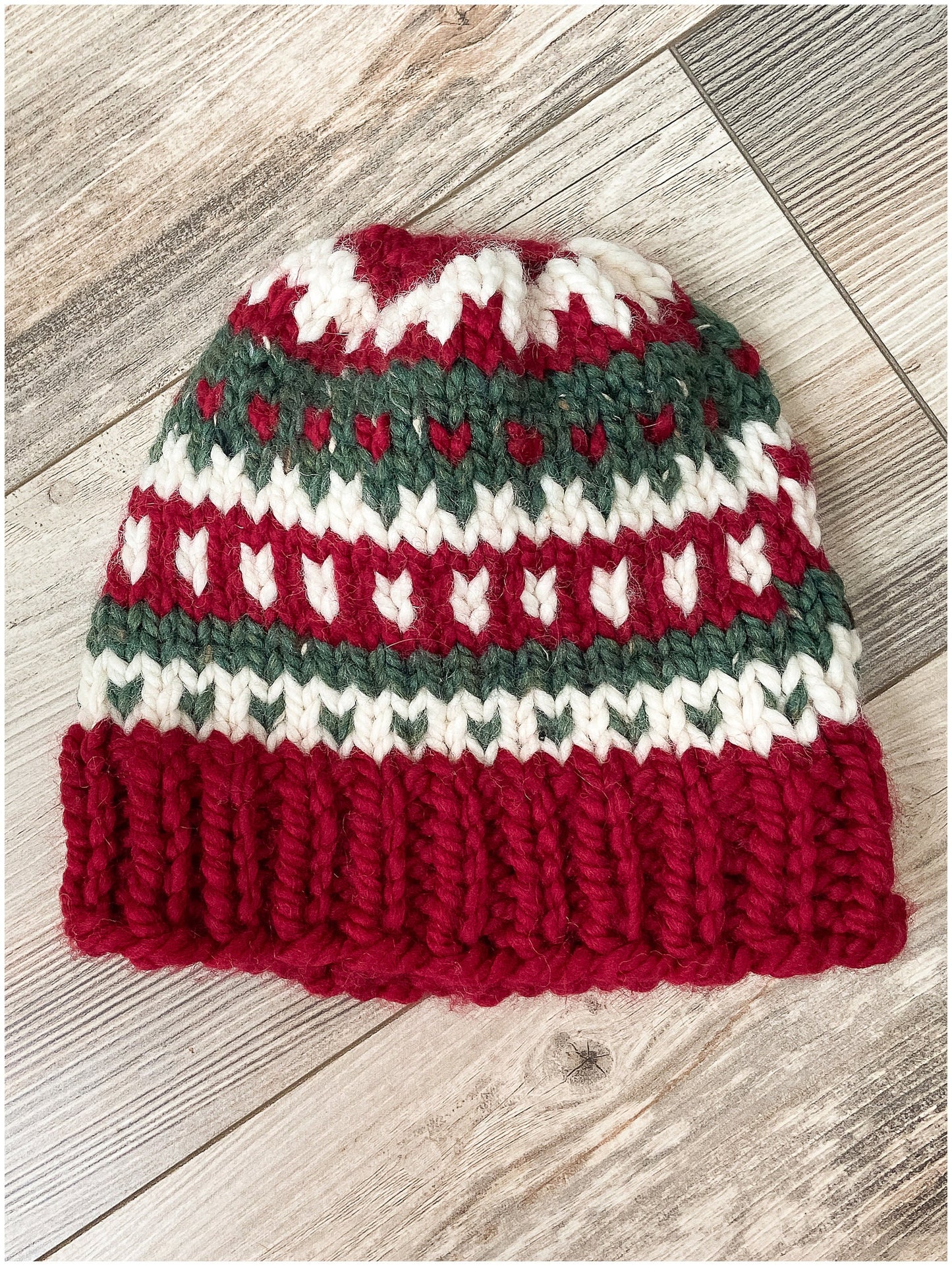 Women's Christmas hat knit in classic fair isle pattern with faux fur pom-pom