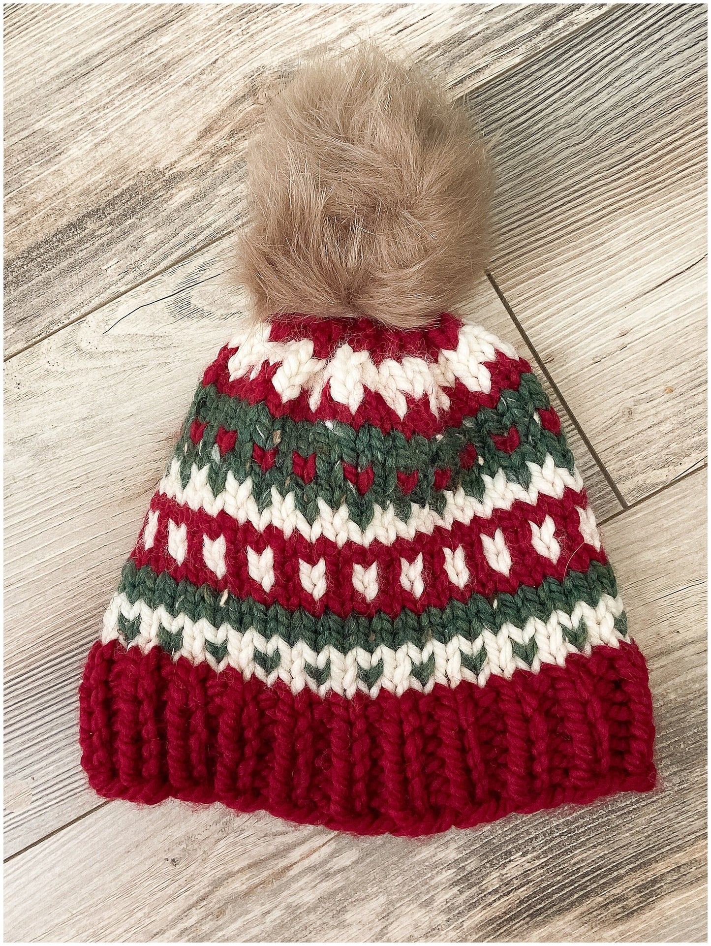 Women's Christmas hat knit in classic fair isle pattern with faux fur pom-pom