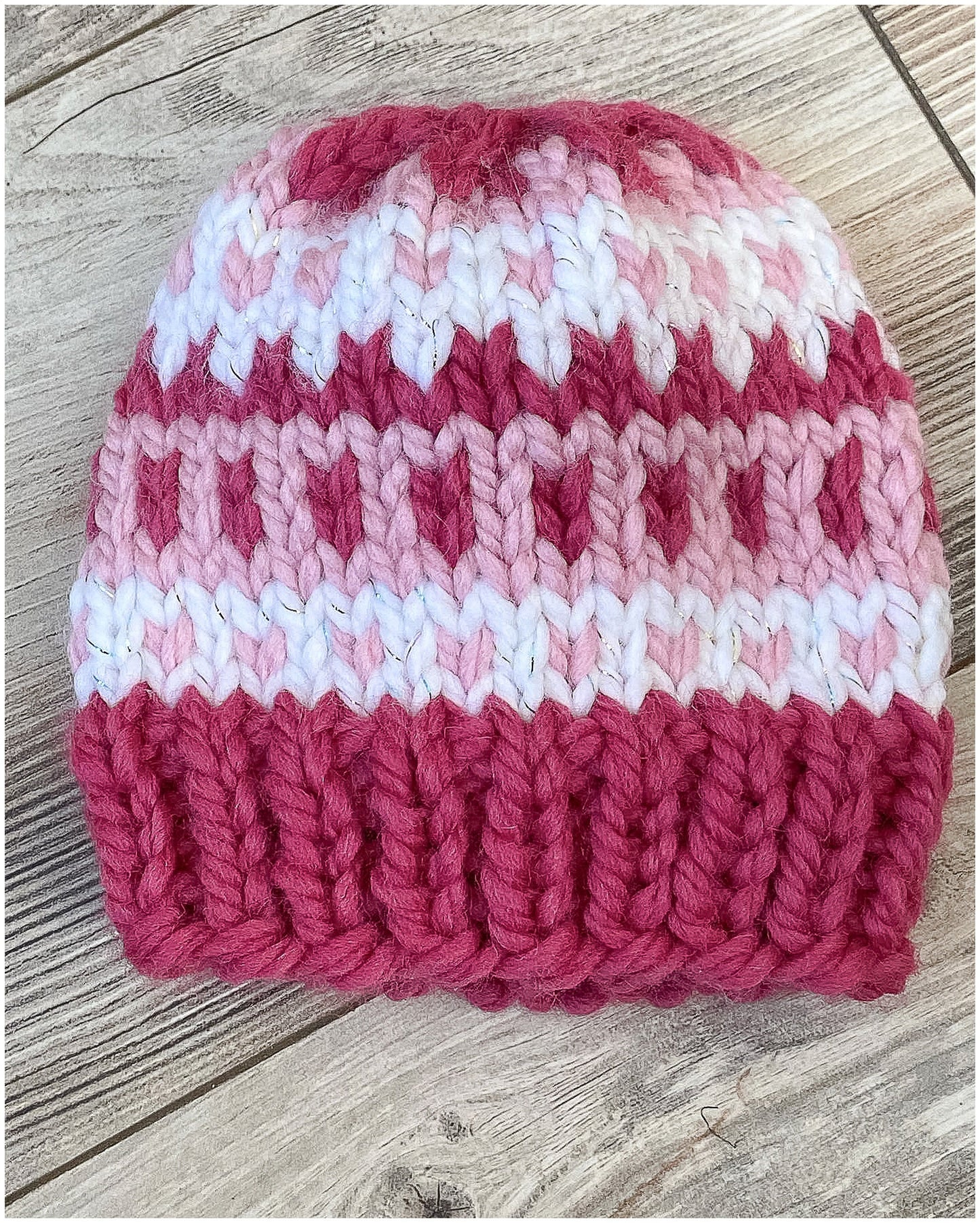 Toddler Girl Fair Isle pink hat in two shades of pink and sparkly white yarn