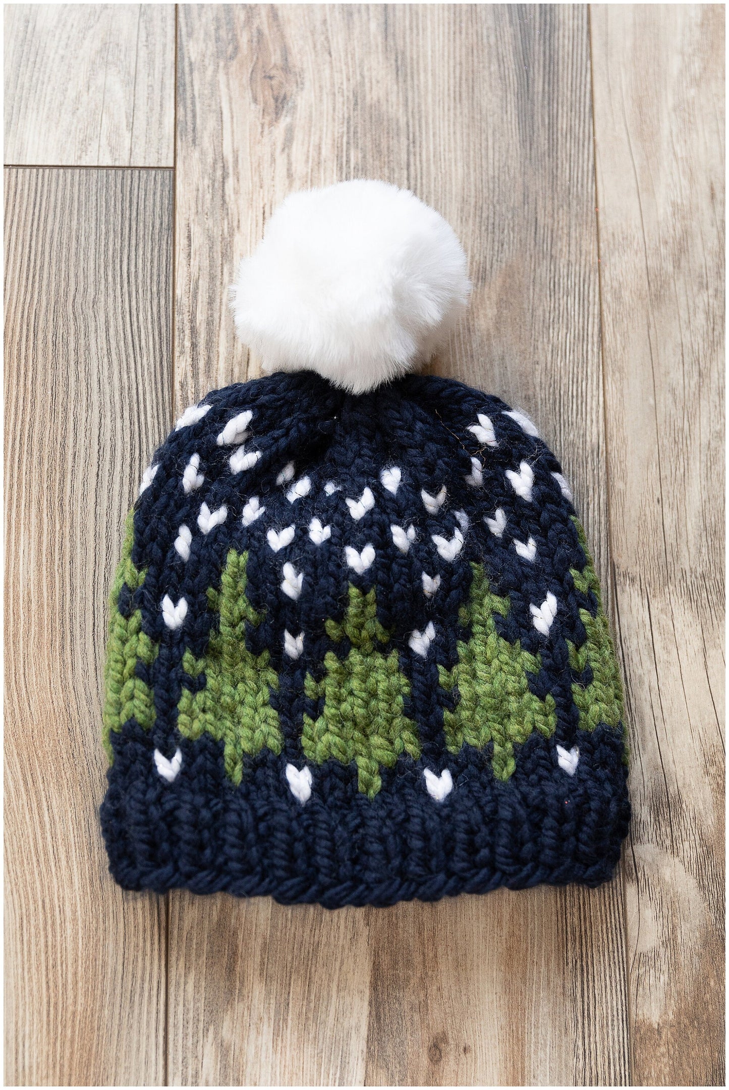 Christmas hat knit in a beautiful fair isle pine trees pattern