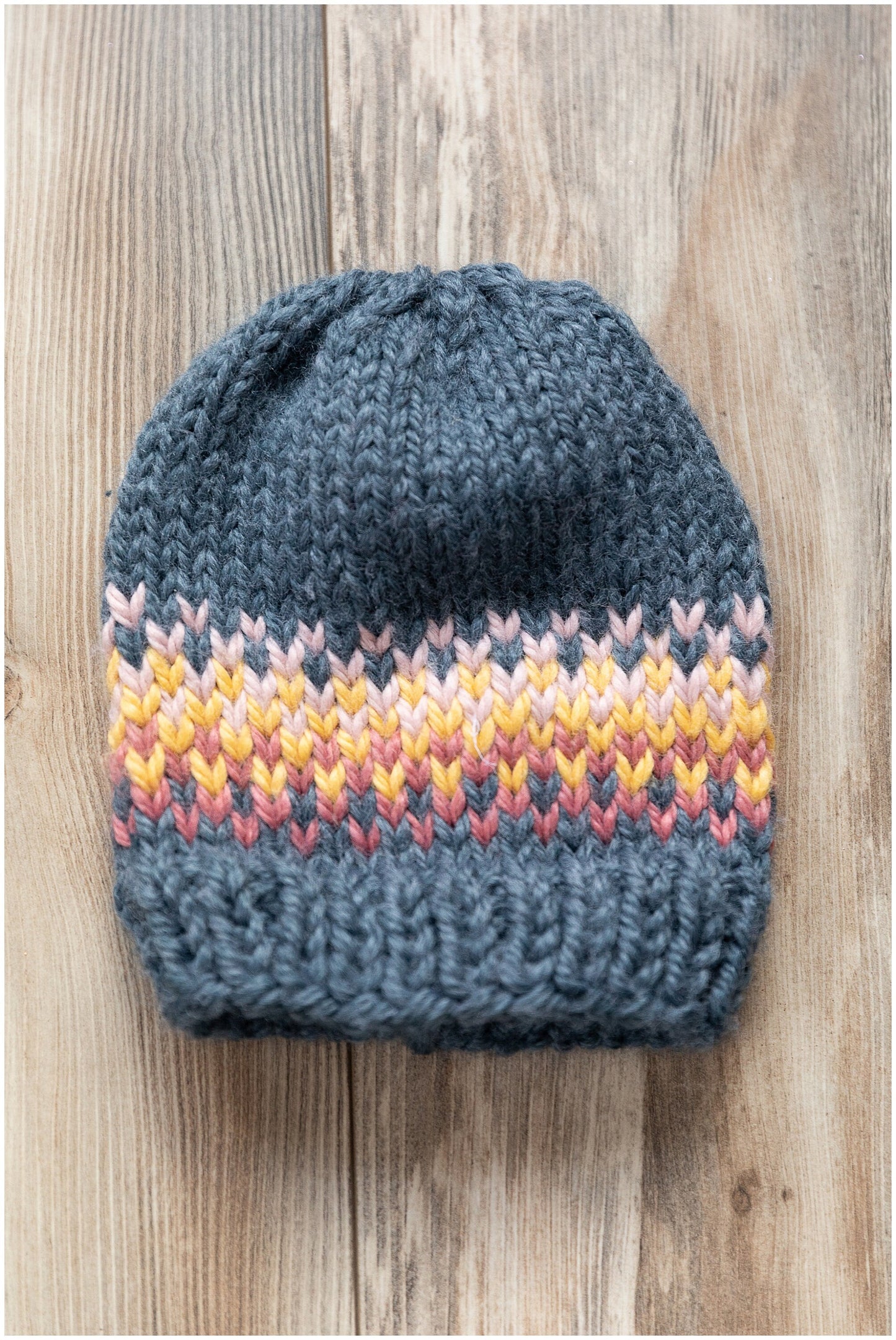Fair Isle rainbow/sunrise slouchy hat made with recycled yarn