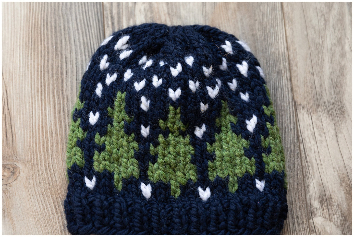 Christmas hat knit in a beautiful fair isle pine trees pattern