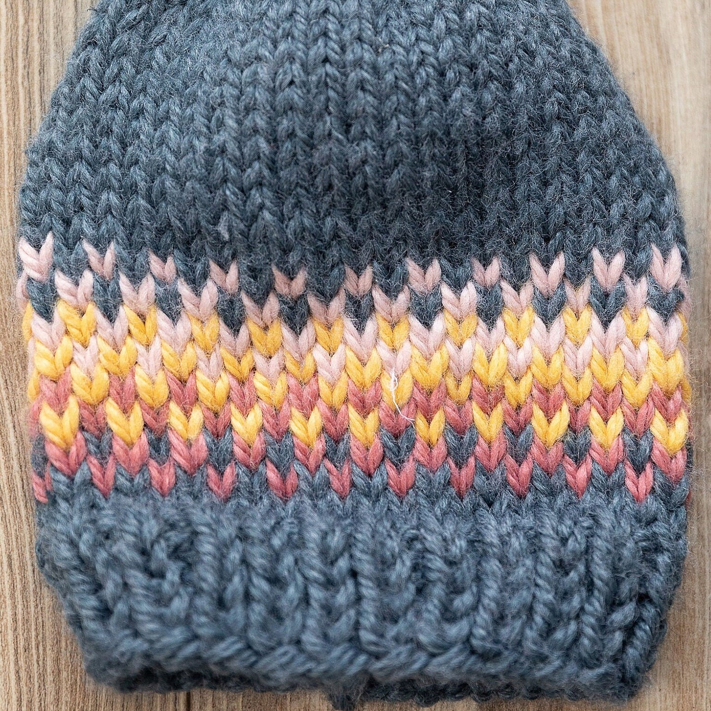 Fair Isle rainbow/sunrise slouchy hat made with recycled yarn